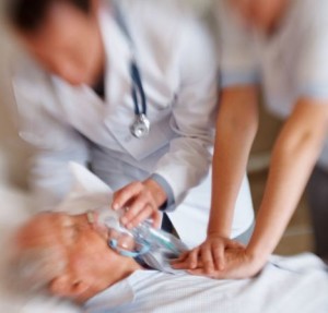 Old man being treated for a heart attack , blurred image