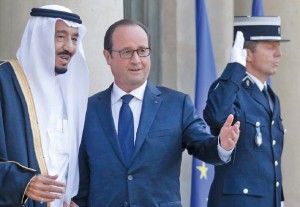 France's President Hollande greets Saudi Arabia's Prince Salman as he arrives for an official dinner at the Elysee Palace in Paris