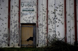 Bullet holes pepper a wall where Muslims were executed in 1995 at an agricultural cooperative in Kravice